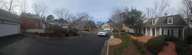 view of road featuring curbs and a residential view