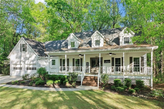 property entrance featuring french doors, a porch, and a ceiling fan