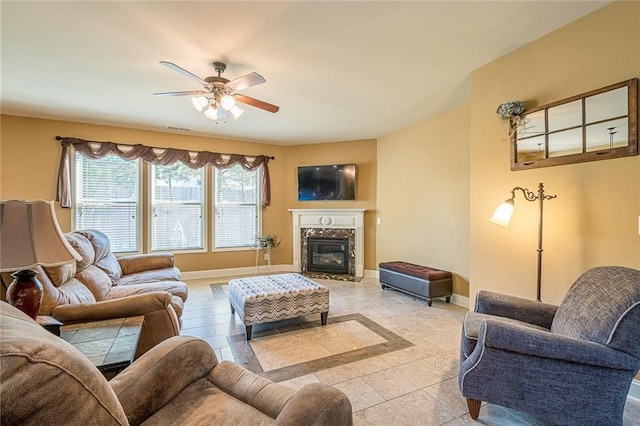 2235 Well Springs Dr, Buford, GA 30519 - living room featuring a ceiling fan, a high end fireplace, baseboards, and light tile patterned flooring