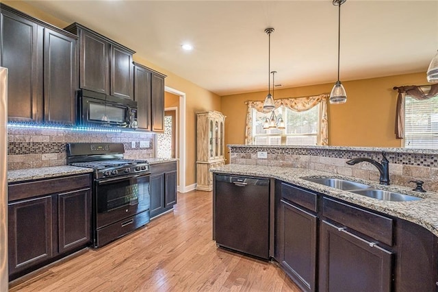 2235 Well Springs Dr, Buford, GA 30519 - kitchen featuring black appliances, a sink, backsplash, light stone countertops, and recessed lighting