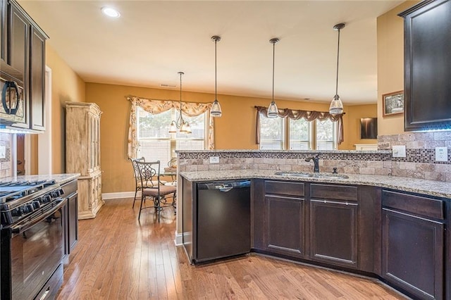 2235 Well Springs Dr, Buford, GA 30519 - kitchen featuring black appliances, a sink, plenty of natural light, light wood finished floors, and recessed lighting