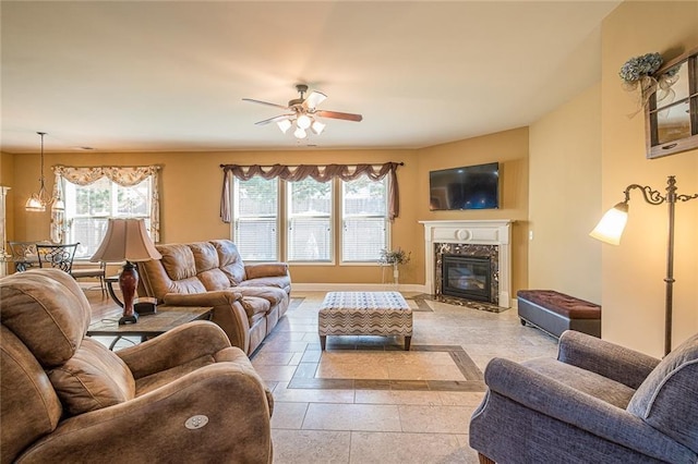2235 Well Springs Dr, Buford, GA 30519 - living area featuring ceiling fan, baseboards, and a premium fireplace