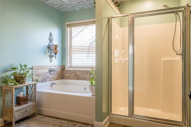 2235 Well Springs Dr, Buford, GA 30519 - bathroom with a shower stall, a garden tub, and an ornate ceiling