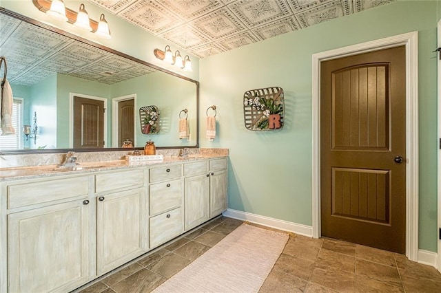2235 Well Springs Dr, Buford, GA 30519 - bathroom featuring an ornate ceiling, baseboards, and double vanity