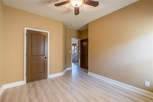 2235 Well Springs Dr, Buford, GA 30519 - spare room with ceiling fan, light wood-type flooring, and baseboards