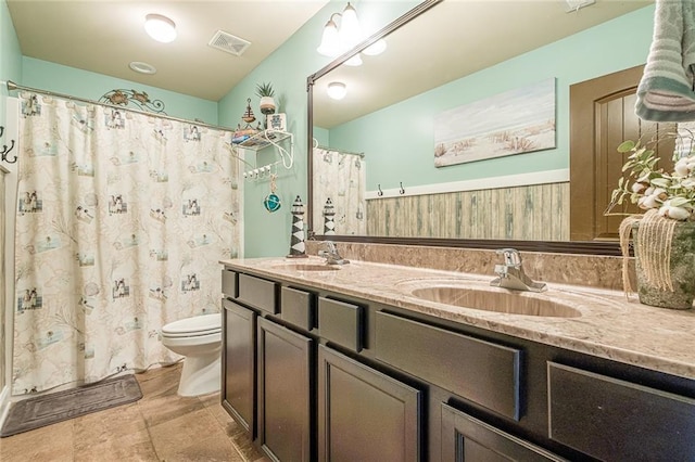 2235 Well Springs Dr, Buford, GA 30519 - bathroom featuring toilet, double vanity, and a shower with curtain
