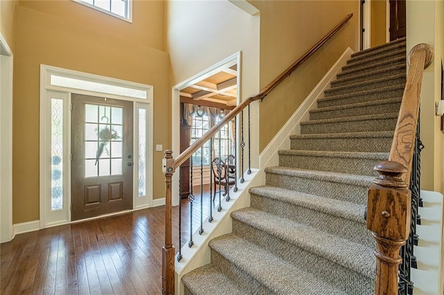 2235 Well Springs Dr, Buford, GA 30519 - foyer featuring stairway, hardwood / wood-style flooring, baseboards, and a towering ceiling