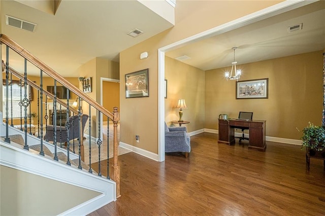 2235 Well Springs Dr, Buford, GA 30519 - foyer entrance featuring wood finished floors, baseboards, stairs, and a chandelier