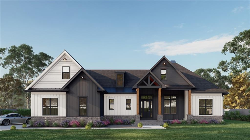 1779 Granade Rd SW, Conyers, GA 30094 - modern farmhouse style home with board and batten siding, a front lawn, and brick siding