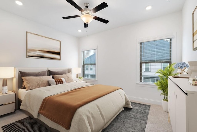 carpeted bedroom featuring ceiling fan