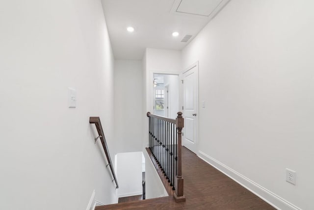 hallway with dark hardwood / wood-style flooring