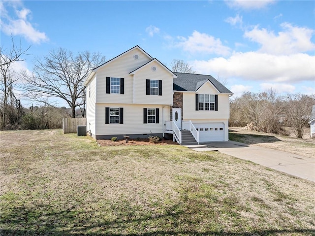 view of front of property featuring a garage, driveway, a front lawn, and cooling unit