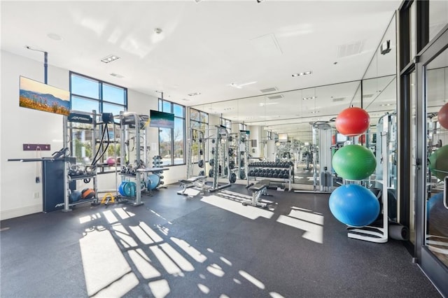 gym with visible vents and baseboards
