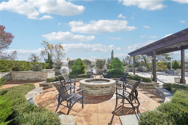 view of patio with an outdoor fire pit
