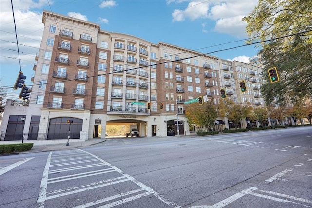 view of property featuring uncovered parking