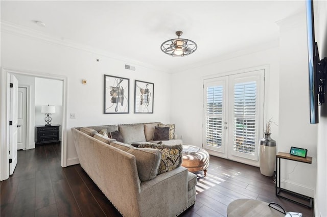 living area with french doors, visible vents, ornamental molding, and dark wood-style flooring