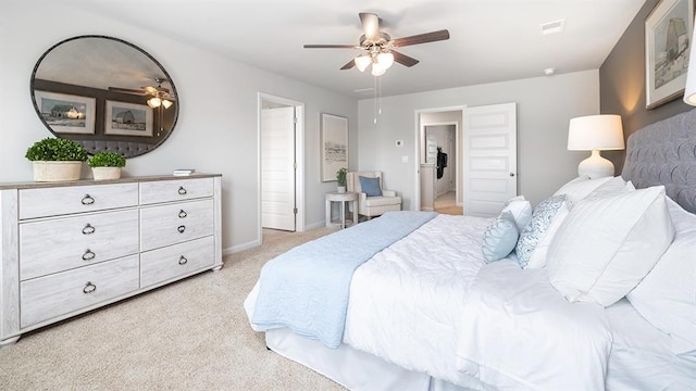 bedroom with light carpet, baseboards, visible vents, and a ceiling fan