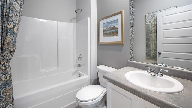 full bathroom featuring vanity, shower / bath combo with shower curtain, and toilet