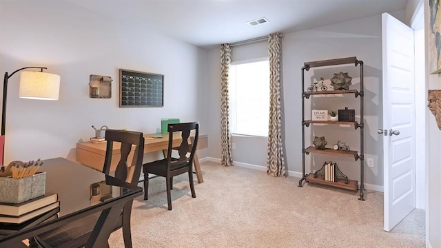 dining room featuring light carpet, visible vents, and baseboards