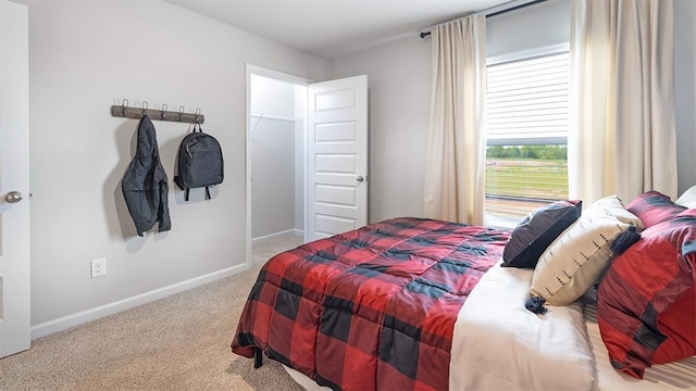 carpeted bedroom with baseboards