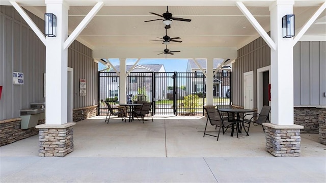 view of patio / terrace with outdoor dining area, ceiling fan, and fence