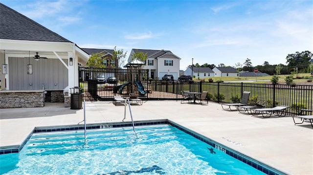 pool featuring a residential view, fence, and a patio