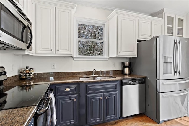 7105 Haw Crk, Gainesville, GA 30506 - kitchen with white cabinetry, blue cabinetry, appliances with stainless steel finishes, and a sink