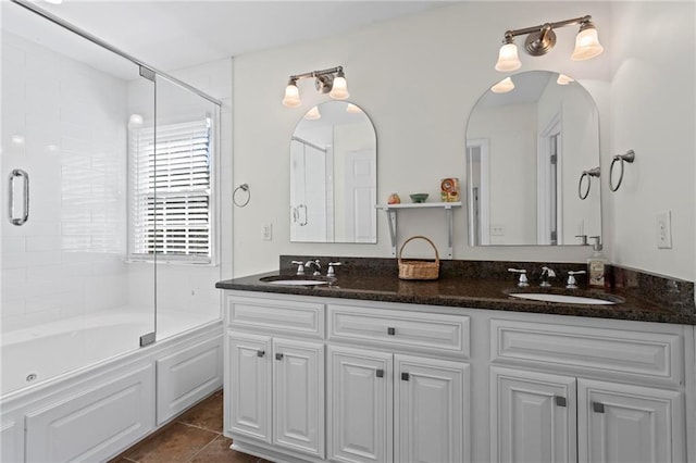 7105 Haw Crk, Gainesville, GA 30506 - full bath with tile patterned floors, double vanity, shower / bath combination with glass door, and a sink
