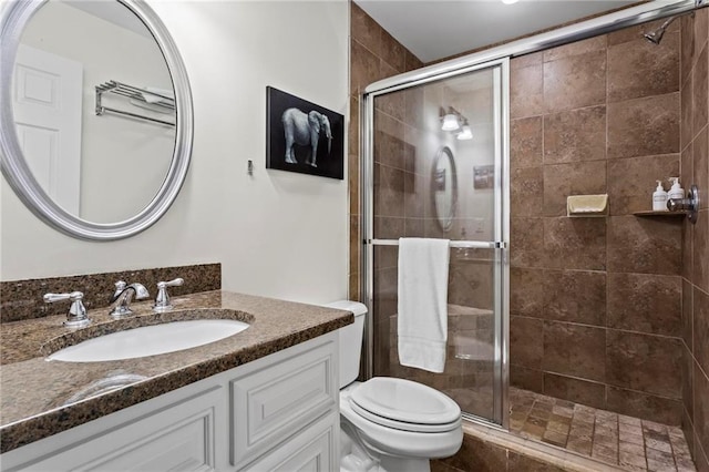 7105 Haw Crk, Gainesville, GA 30506 - full bathroom featuring toilet, a stall shower, and vanity