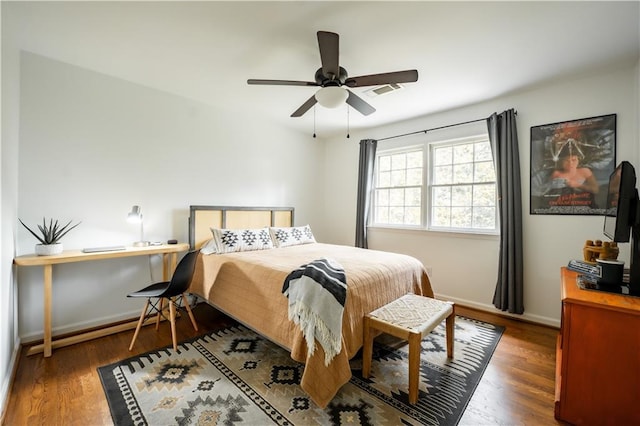 bedroom featuring ceiling fan and dark hardwood / wood-style floors