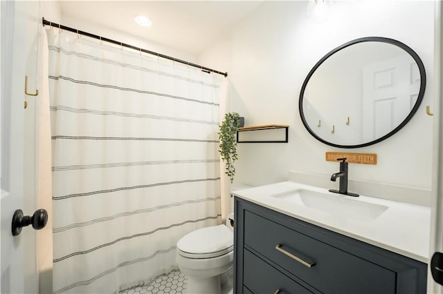 bathroom with tile patterned flooring, vanity, toilet, and a shower with curtain