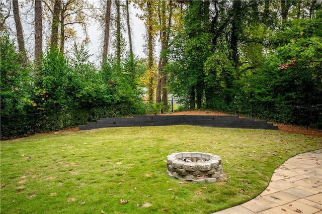 view of yard with a fire pit