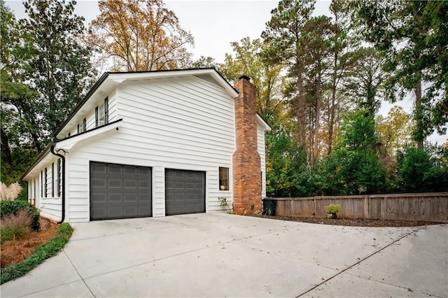 view of property exterior with a garage