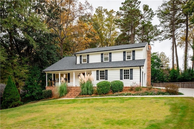 view of front of property with a front lawn and covered porch