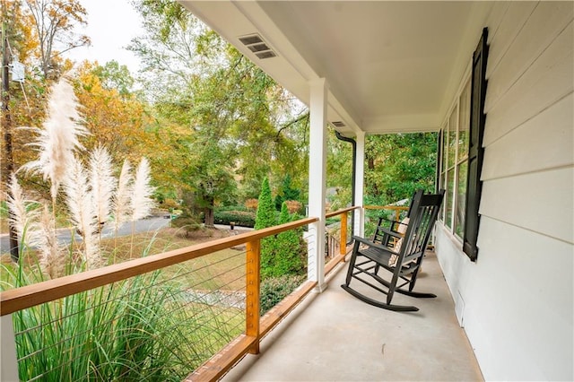 balcony featuring a porch