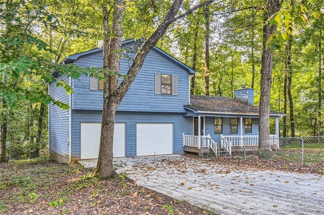 view of front of home featuring a garage and a porch