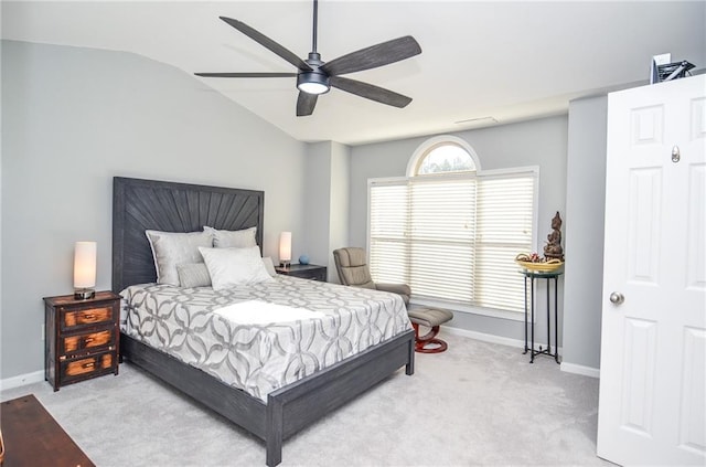 carpeted bedroom with ceiling fan and lofted ceiling