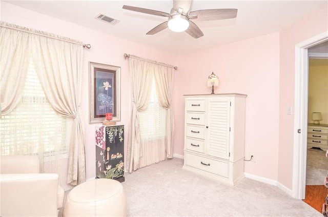 sitting room with light carpet and ceiling fan