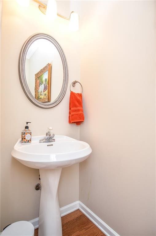 bathroom featuring sink and hardwood / wood-style floors