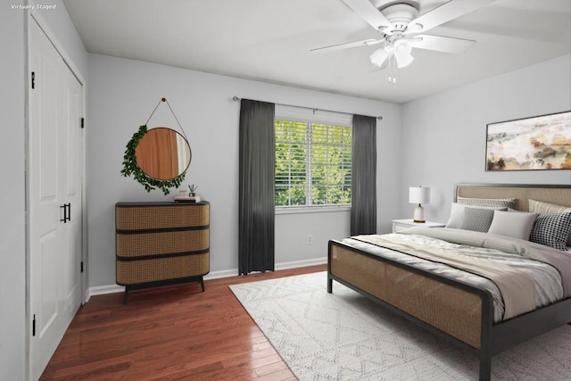 bedroom featuring ceiling fan and dark hardwood / wood-style flooring