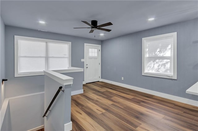 foyer entrance featuring baseboards, ceiling fan, recessed lighting, and dark wood-style flooring