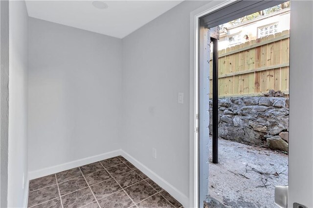 interior space featuring baseboards