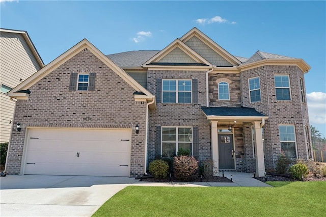 craftsman-style home with brick siding, driveway, an attached garage, and a front yard