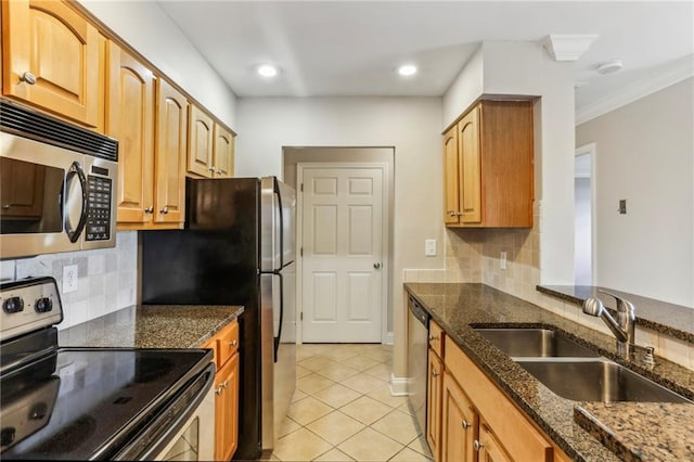 300 Johnson Ferry Rd NE Unit A811, Atlanta, GA 30328 - kitchen with stainless steel appliances, dark stone counters, decorative backsplash, light tile patterned floors, and ornamental molding