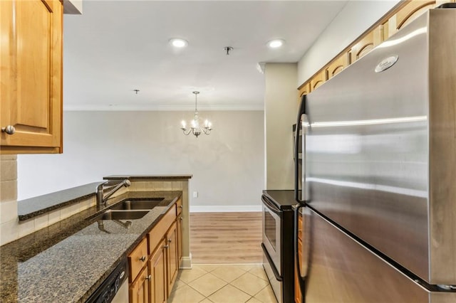 300 Johnson Ferry Rd NE Unit A811, Atlanta, GA 30328 - kitchen with appliances with stainless steel finishes, light tile patterned floors, dark stone counters, crown molding, and a chandelier