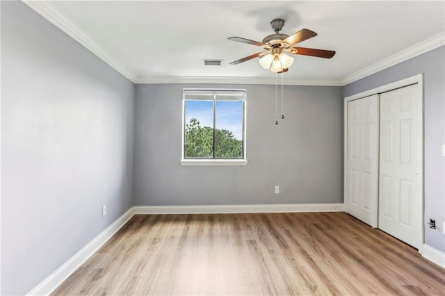 300 Johnson Ferry Rd NE Unit A811, Atlanta, GA 30328 - unfurnished bedroom with light wood finished floors, ornamental molding, a closet, and ceiling fan