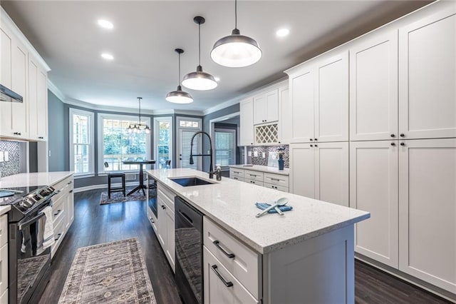 3845 Glen Ian Dr, Loganville, GA 30052 - kitchen featuring electric range, a sink, dishwashing machine, ornamental molding, and white cabinetry