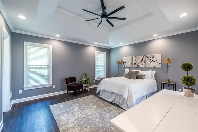 3845 Glen Ian Dr, Loganville, GA 30052 - bedroom with a tray ceiling, baseboards, dark wood-style floors, crown molding, and ceiling fan