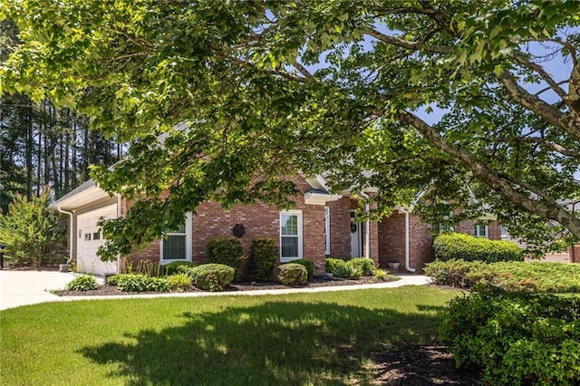 3845 Glen Ian Dr, Loganville, GA 30052 - obstructed view of property with a front lawn, a garage, brick siding, and driveway