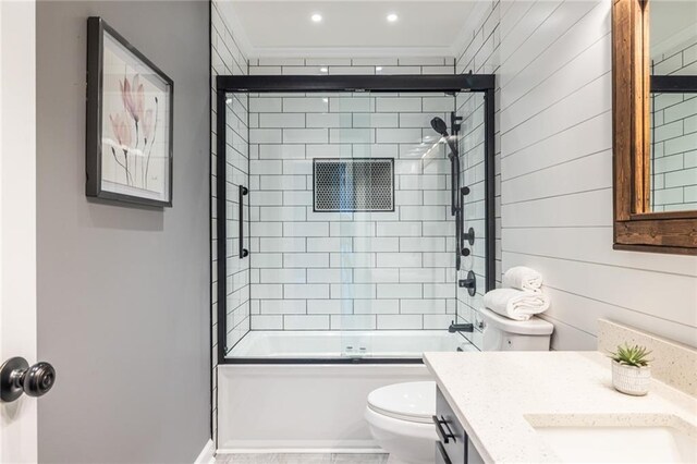 3845 Glen Ian Dr, Loganville, GA 30052 - bathroom with toilet, vanity, enclosed tub / shower combo, and crown molding